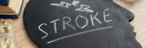 'Stroke' written on a blackboard in the shape of a human head