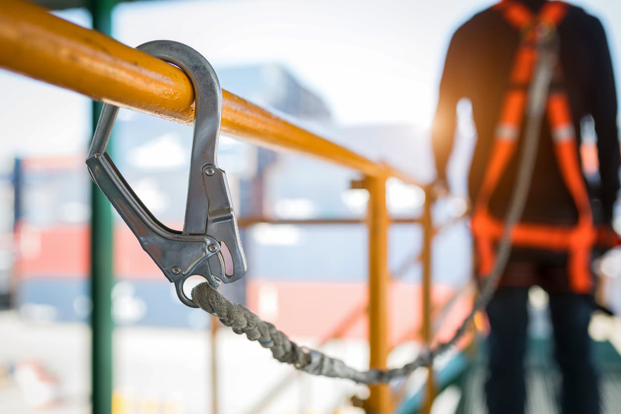 worker strapped to scaffold