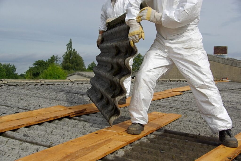 people in haz mat suits removing asbestos
