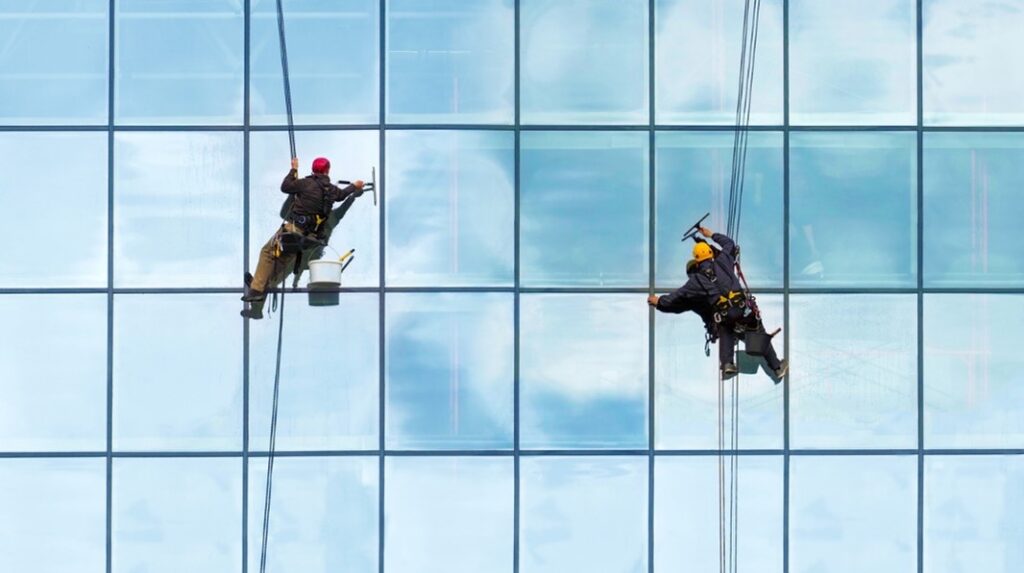 Working at height cleaning windows
