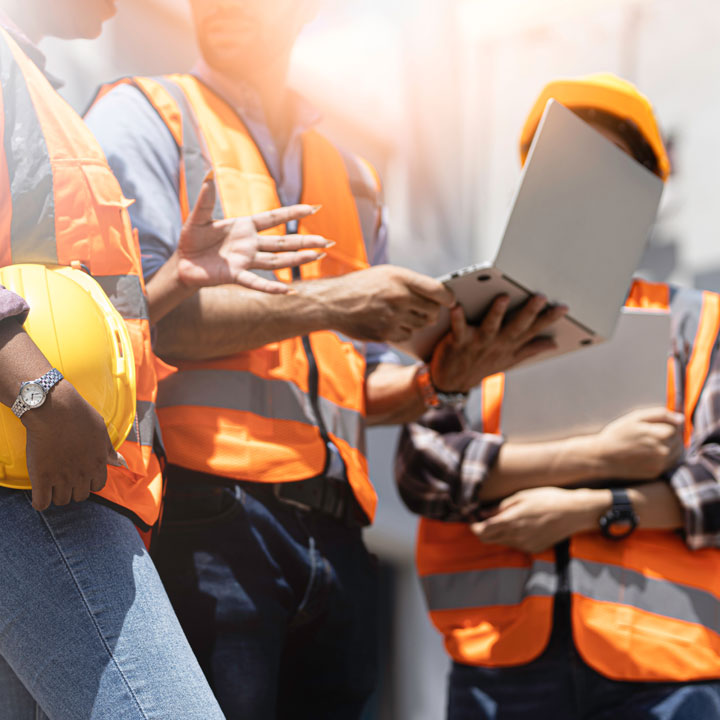 workers-with-laptop-on-site